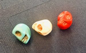 In-game: green, white, and red skulls.