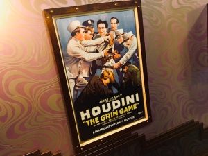In-game: a poster advertising Houdini's "The Grim Game."