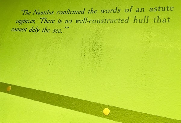 In-game: a quote from "20,000 Leagues Under the Sea"painted to the wall: "The Nautilus confirmed the words of an astute engineer, 'There is no well-constructed hull that cannot defy the sea."