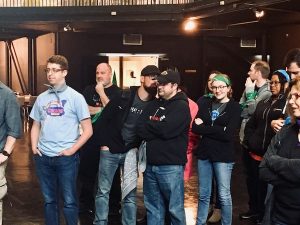 Lisa and Drew surrounded by other players.