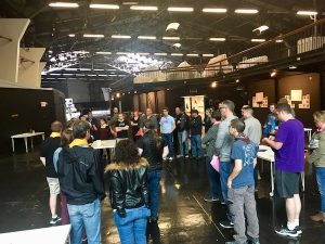 Wide shot of all of the players gathered.