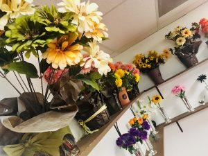 In-game: shelves of flowers.