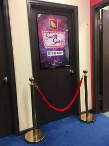 In-game: The entry to Rock Star, a velvet rope before the doorway.