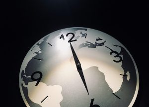 In-game: a gray-scale clock depicting the Earth