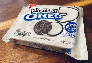 The bright white Mystery Oreo packaging with a question mark dotted with an oreo.