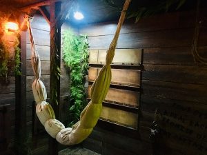 In-game: sails tied up and hung inside the ship.