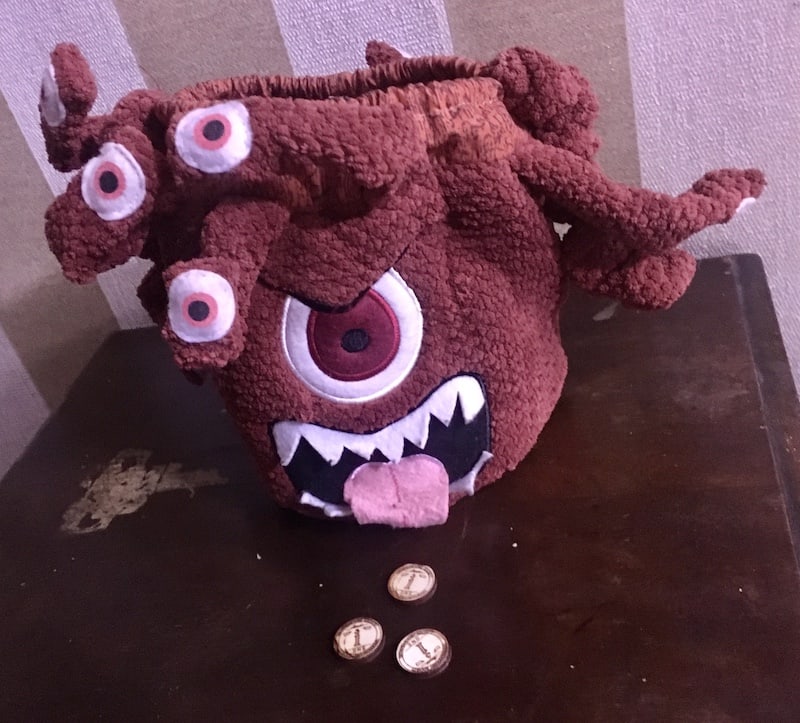 A stuffed Beholder on a table.