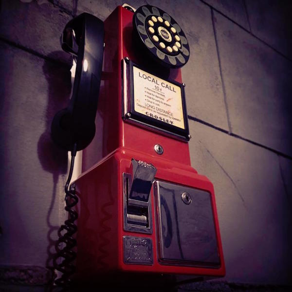 In-game: a red faux rotary pay phone.