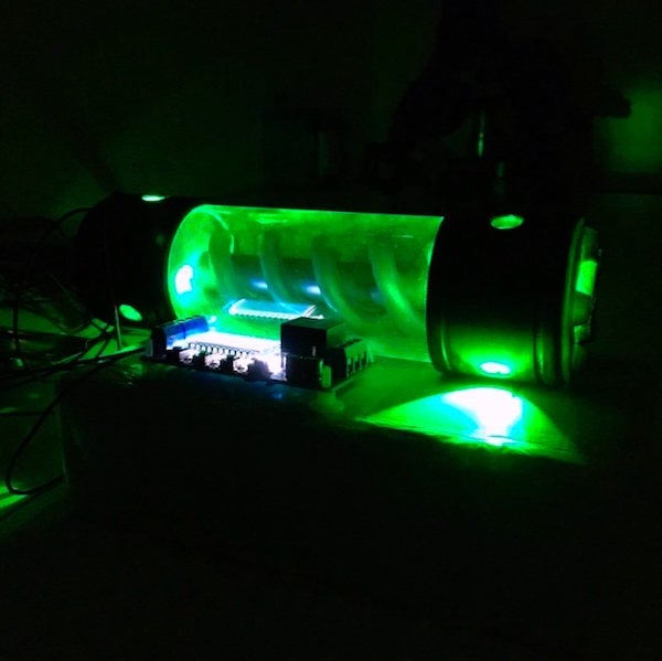 In-game: a strange coiled device glowing green.