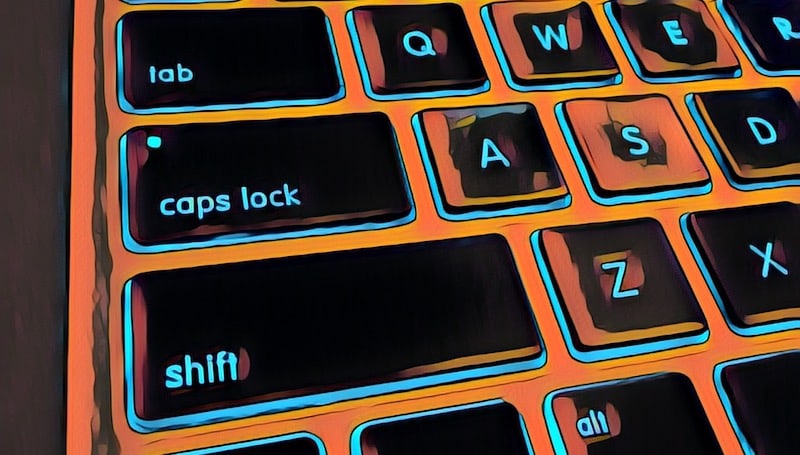 Close up stylized image of the shift and caps lock keys on a Mac keyboard.