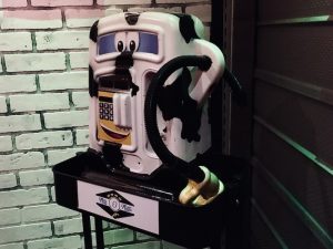 In-game: A toy gas pump painted like a cow.