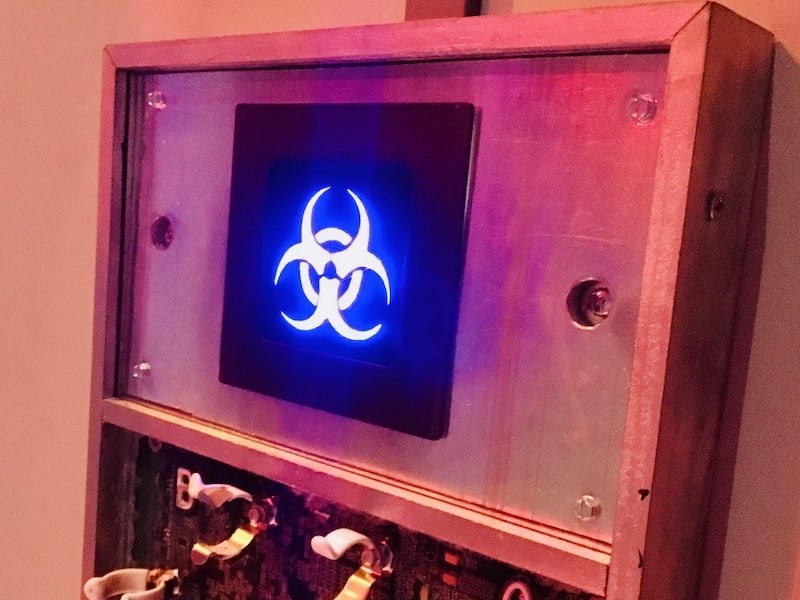 In-game: A piece of machinery with an illuminated blue biohazard symbol.