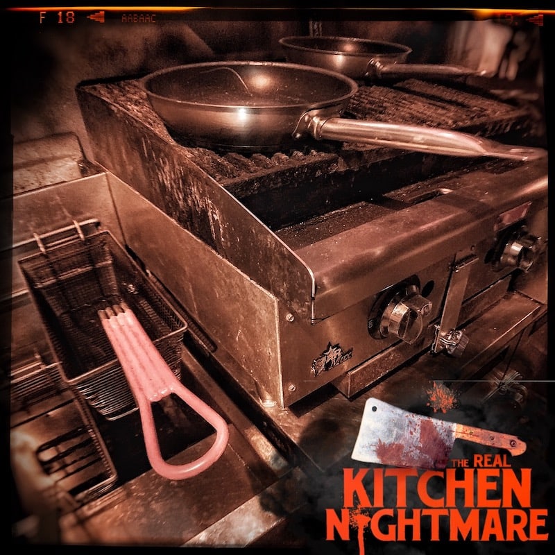 In-game: A frying pan on an restaurant stove beside a deep fryer.