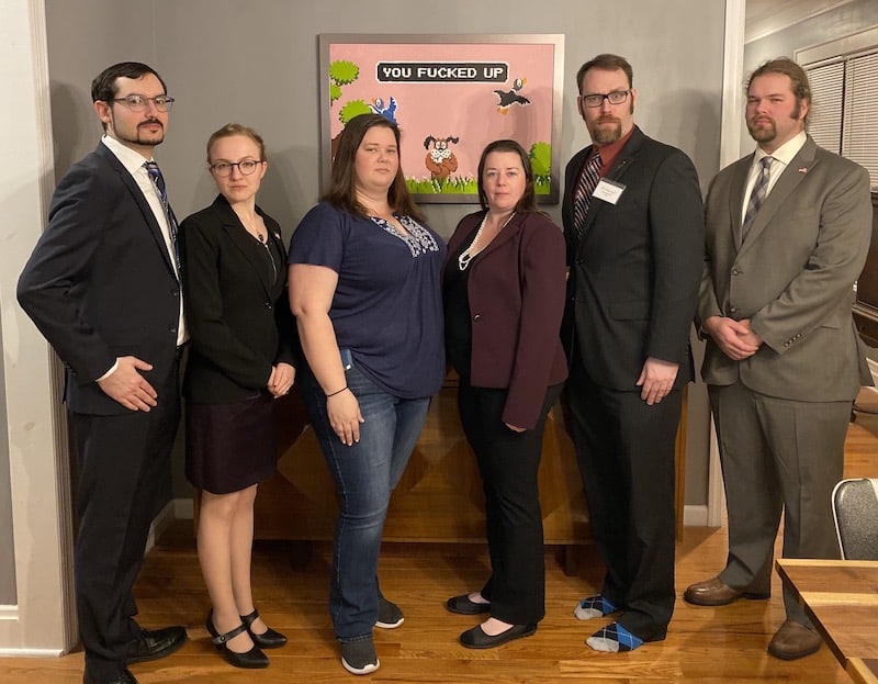 Left to right, David, Lisa, Amanda, Lindsay, Mike, Andrew - all dressed well and looking very serious.