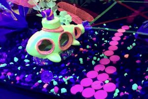 In-game: closeup of a fishtank with a yellow submarine inside of it.