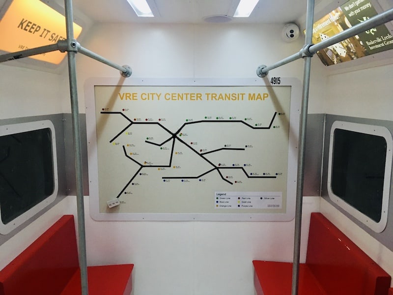 In-game: A subway map along the back wall of the train car.