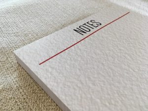 A large notepad that says "Notes" at the top.