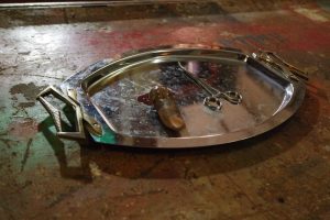 In-game: a severed thumb on a surgical tray.