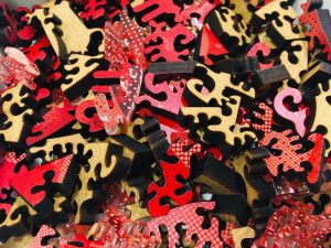 Unassembled unusually shaped wooden jigsaw puzzle pieces. pieces