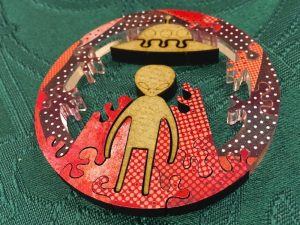 Mini puzzle within the puzzle depicts an alien beaming up to its ship.