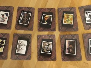 10 stacks of cards with photographs and art on the back.