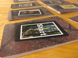 Closeup of a stack of cards that reads "Start"