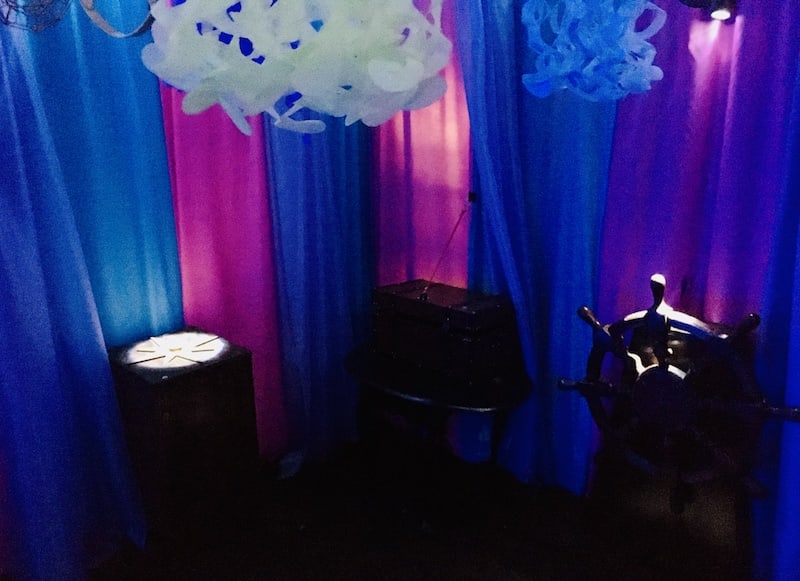 In-game: The mermaid's tent adorned with a compass and ship's wheel.