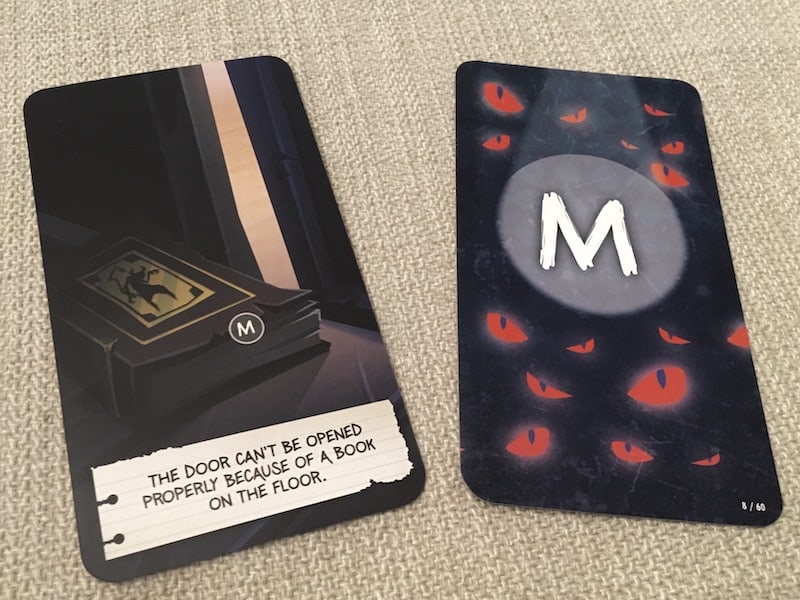 A card depicts a book holding a door closed.