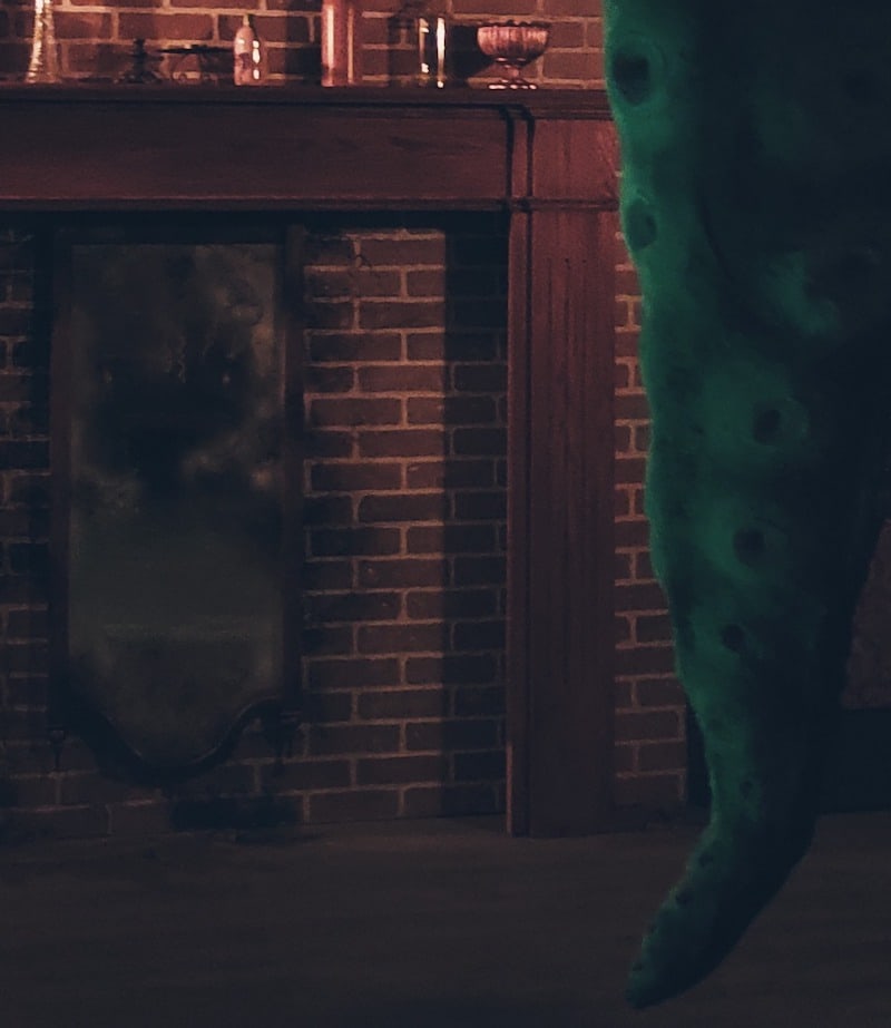 In-game: A large tenticle coming from the ceiling of a study.