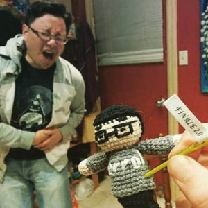 Errol feeling the pain as his voodoo doll is stabbed witha pin labeled "finale 2.0"