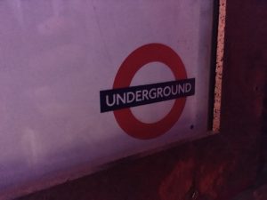 In-game: Close up of a London Underground symbol.