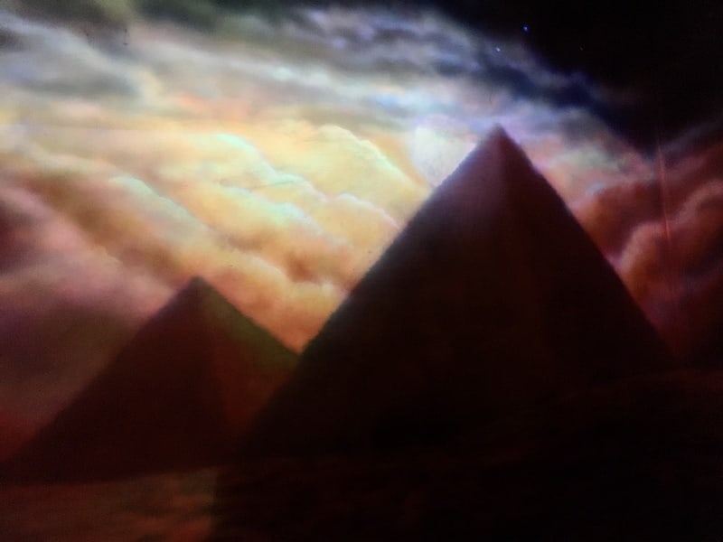 In-game: a beautiful mural of Egyptian pyramids in the moonlight.