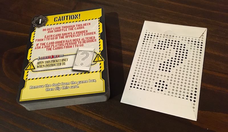 The deck of cards and a mysterious envelope.