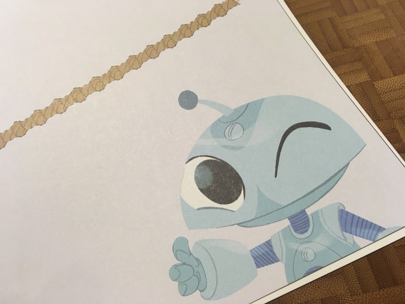 Dooz giving a thumbs up beside a length of rope.