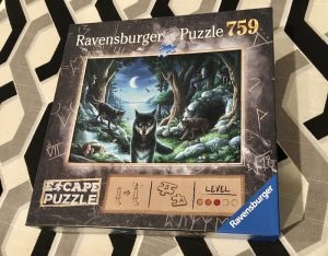 Ravensburger's The Curse of the Wolves Escape Puzzle box art depicting a pack of wolves in the moonlight.