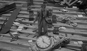 The iconic scene from The Twilight Zone's "Time Enough at Last." The man on Earth surrounded by his books just before he breaks his glasses.