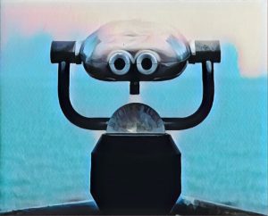 Mounted binoculars overlooking water.