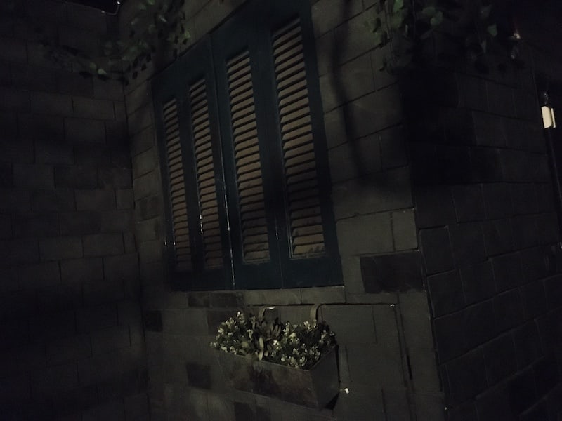 In-lobby: a shuddered building at night.