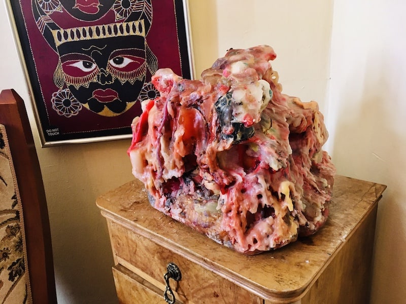 In-game: A strange, multi-color, oversized asymmetrically melted candle.