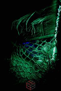 In-game: A cargo net under a thatch roof.