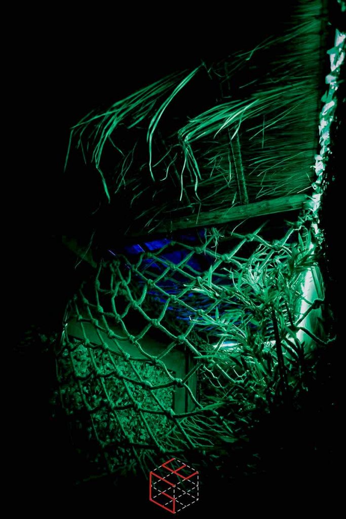 In-game: A cargo net under a thatch roof.