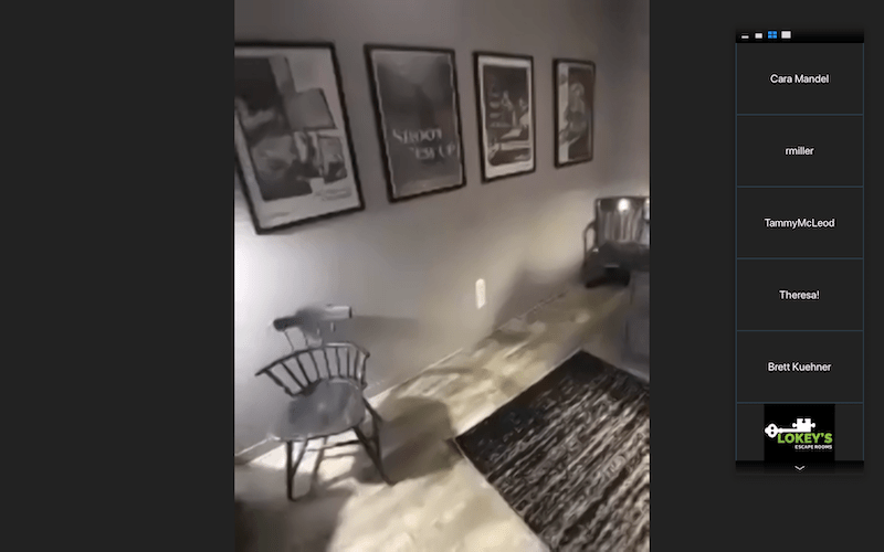 A collection of movie posters up on the wall.