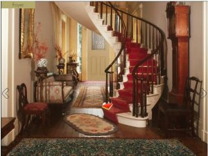 A spiral staircase in a stately manor.
