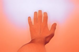 First-person view of a hand reaching out.