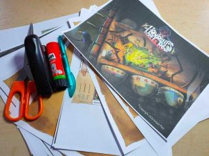 Houdini's Secret Room papers printed with scissors, a pen, a stapler, and a gluestick.