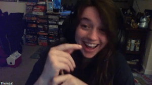 Theresa smiling and looking very surprised.