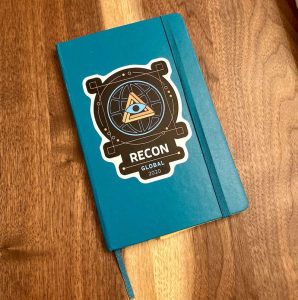 Notebook with the RECON die-cut sticker.