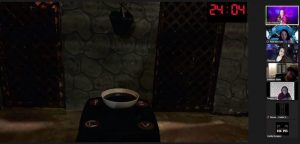 Zoom view of a castle-like set. There is a bowl that appears to be filled with blood in the cnter of the room.
