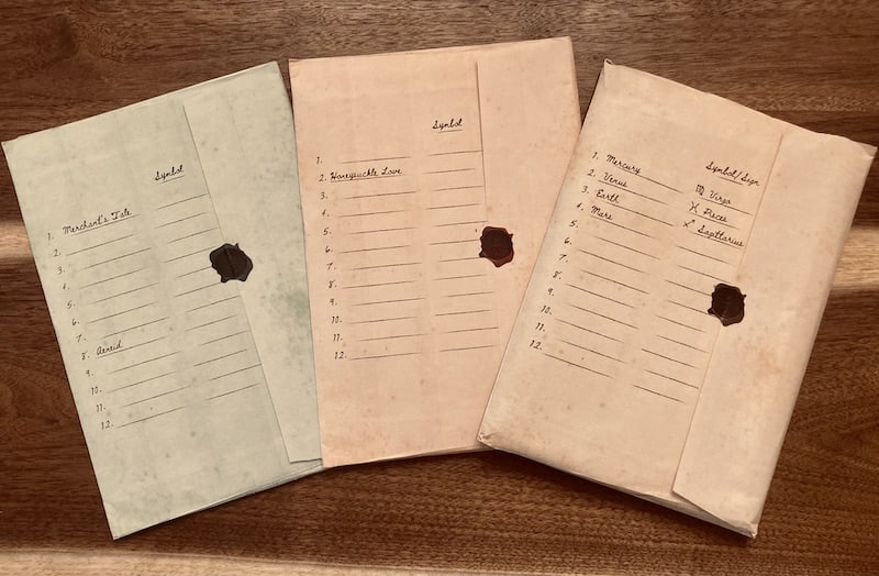 3 sealed envelops, one green, one red, and one brown.