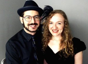 Lisa & David dressed for a night out, in front of Zoom.